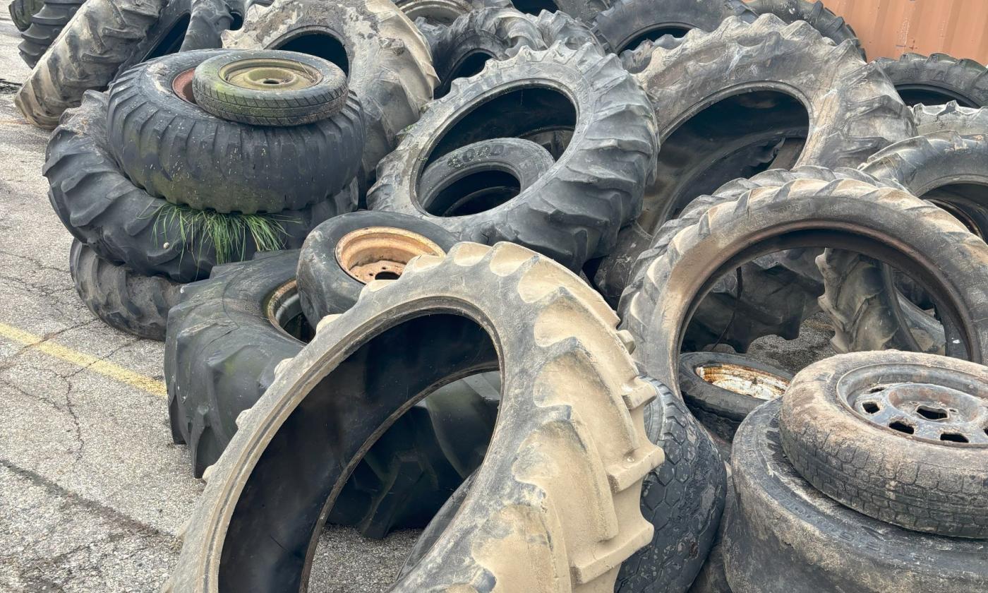 Agricultural tires waiting to be loaded onto the Environmental Rubber Recycling trailer.