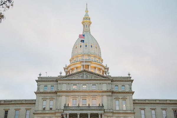 Image of the Michigan Capitol on a cloudy day.